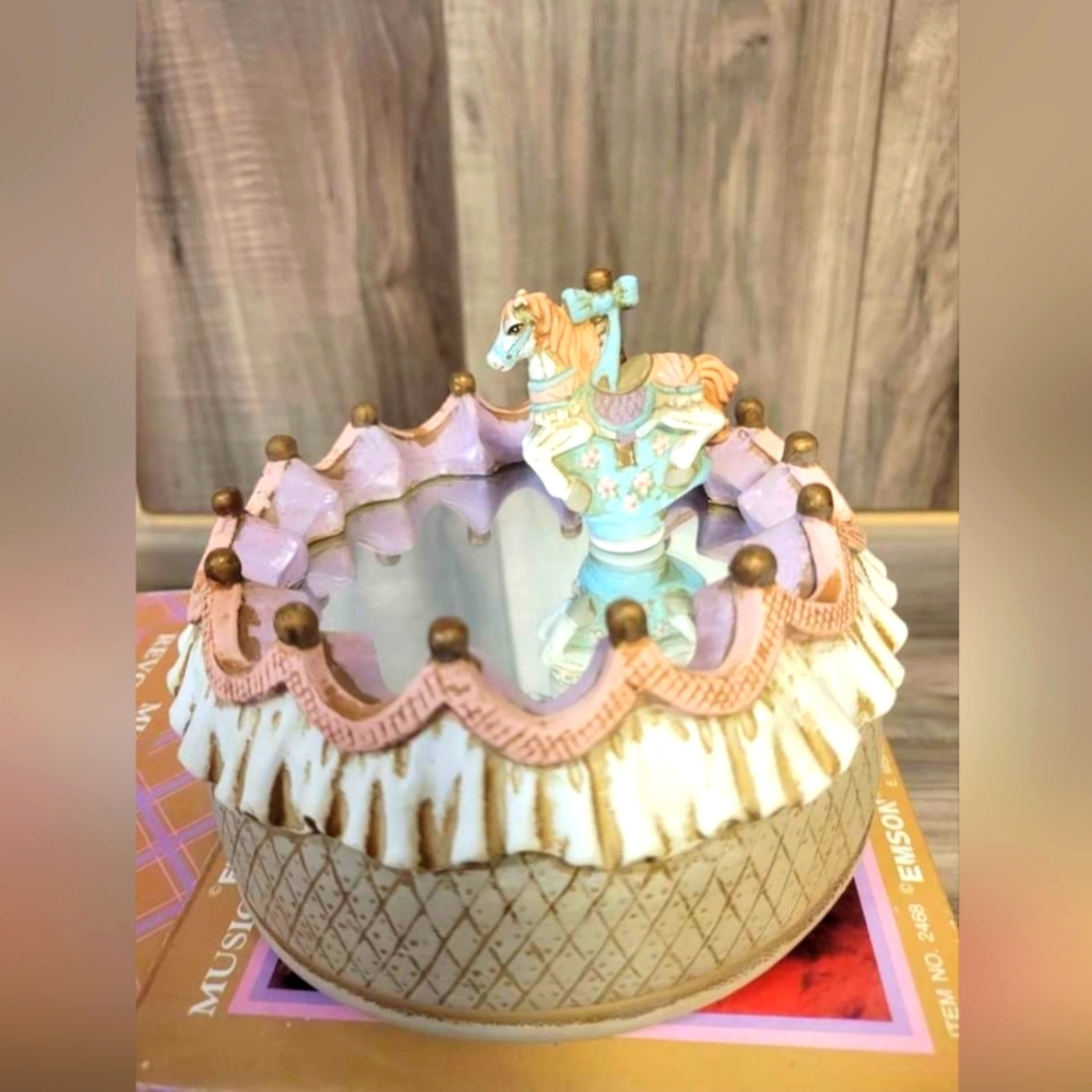 Musical revolving carousel